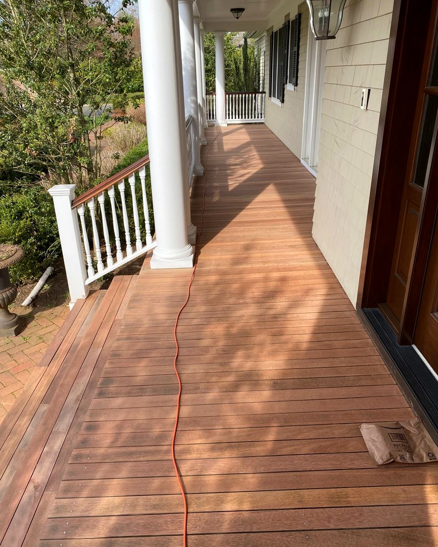 A wraparound porch deck finished and ready for use.