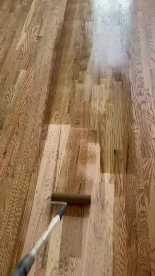 Finish being rolled onto a freshly sanded hardwood floor.